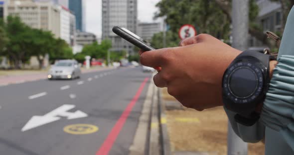 Hands of african american businesswoman using smartphone