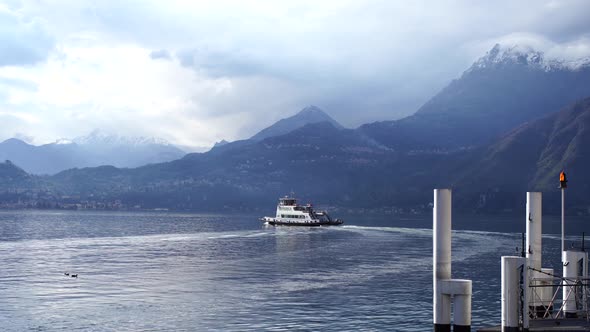 Ship Sails on Lake Como Against the Backdrop of the Coast