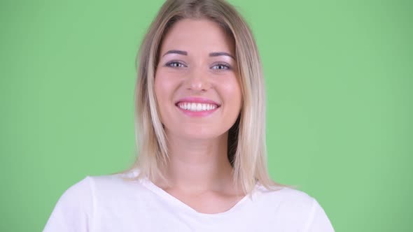 Face of Happy Young Beautiful Blonde Woman Smiling