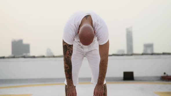 Fellow Training Yoga By Turning His Body On An Upward Motion