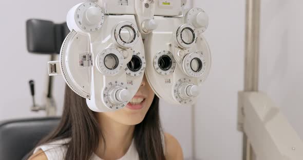 Woman doing eye test at the clinic 