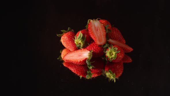 Strawberry Piles On The Floor Mirror In A Black Scene