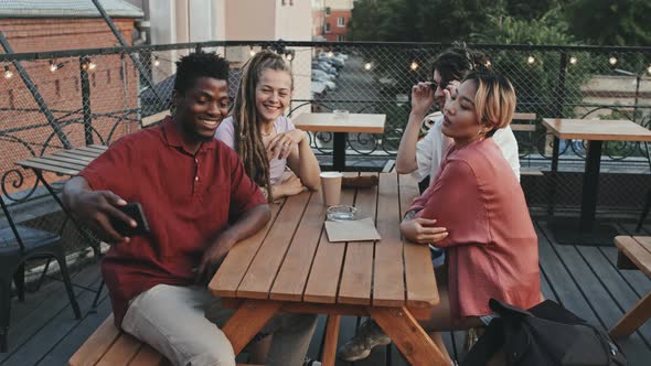 Multiethnic Friends Taking Selfie at Outdoor Cafe