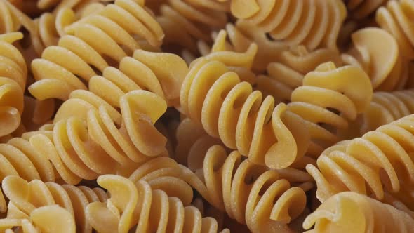 Close Up Image of Buckwheat Fusilli Pasta. Slow Rotation Close Up