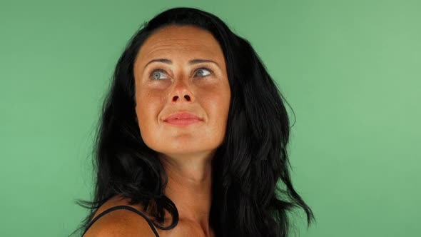 Happy Mature Woman Looking Surprised on Green Chromakey