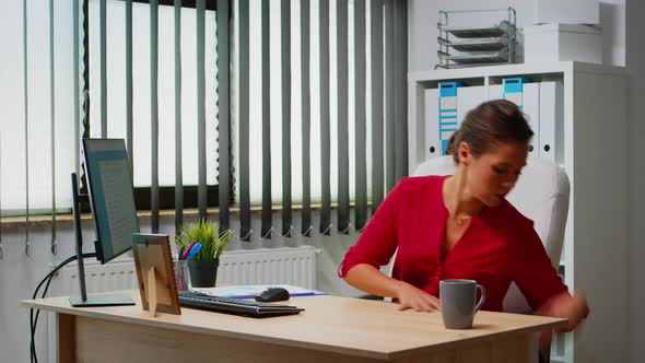 Businesswoman Working at Laptop