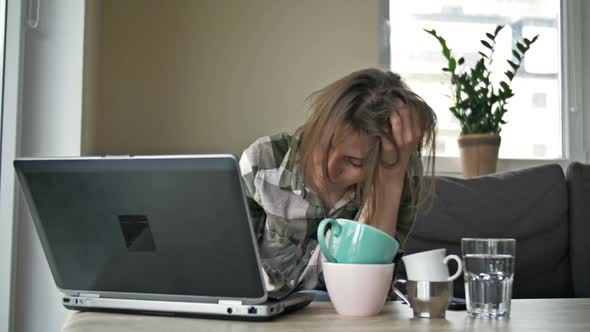 Very Tired Business Woman Working with Laptop at Home