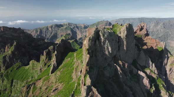 Aerial View of a Range of Mountains Covered with Dense Clouds