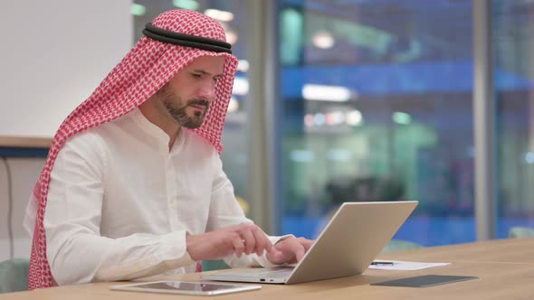 Loss Arab Businessman Reacting to Failure on Laptop