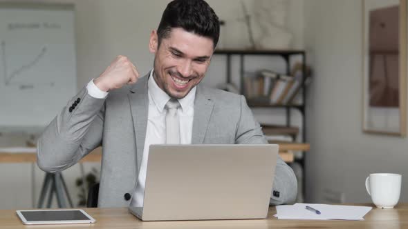 Businessman Celebrating Success at Work