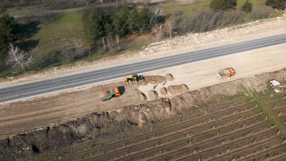 Aerial View on the New Asphalt Road Under Construction