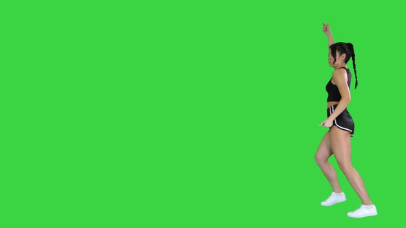 R'n'B Girl in Shorts Walking Dancing on a Green Screen, Chroma Key