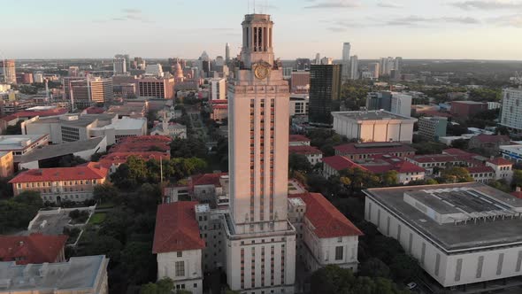 Slow drone approach of the tower at UT. Shot during sunset with Downtown in the background.