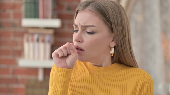 Portrait of Sick Young Woman Coughing