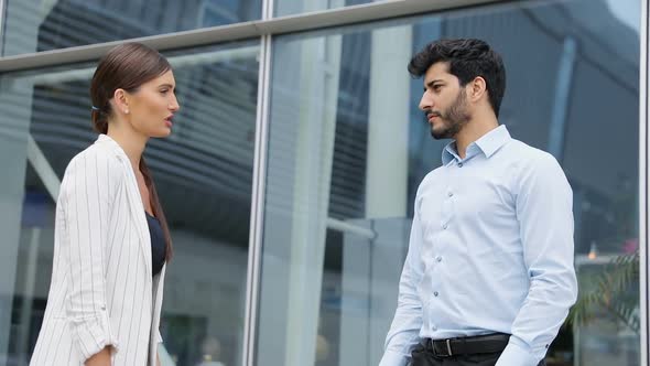 Business People Near Office Ending Meeting With Shaking Hands