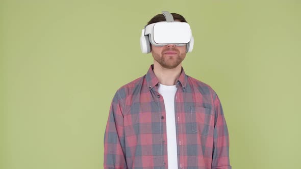 A Young Man Uses Vr Glasses to Work with Innovative Modeling