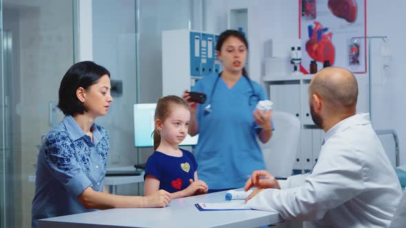 Male Doctor Holding Pills Bottle