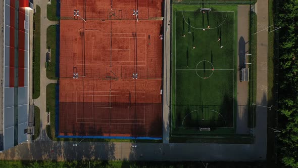 Top View of Sports Grounds with People Playing on Them in Minsk.Football Field and Tennis Courts in