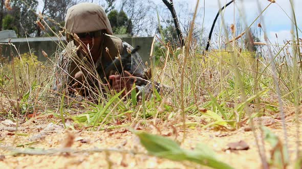 Military soldier guarding with a rifle