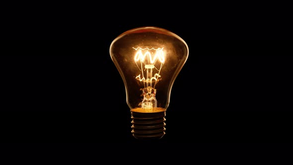 4K - Silhouette of a flicker incandescent light bulb