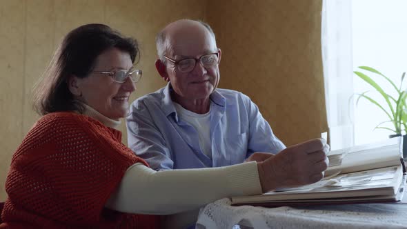 Happy Memories, a Loving Elderly Husband Enjoys Family Life Kisses His Beloved Cheerful Elderly Wife