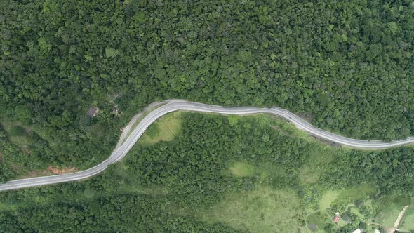 Construction landscape of highway road between green mountains.