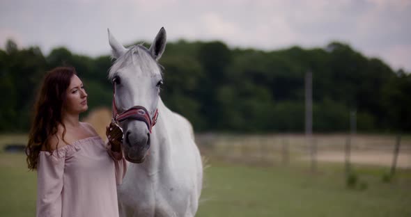 Woman Riding Horse on Farm. Recreation - Woman Walking with Horse