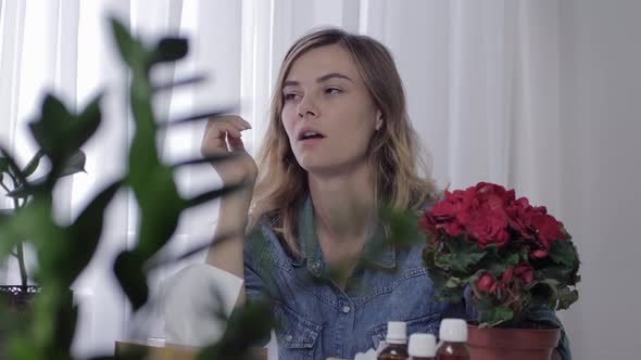 Girl Suffers From Seasonal Allergies Is Constantly Sneezing and Blowing Nose in a Handkerchief