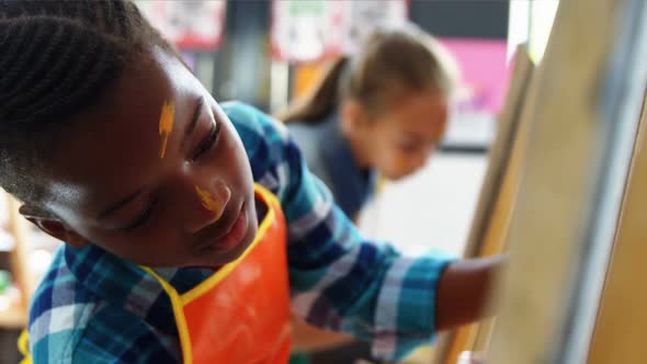 Attentive schoolboy panting on canvas