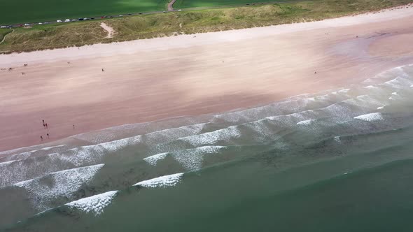 Aerial footage of the seaside coastal town of the village of Seahouses, a large village in the UK