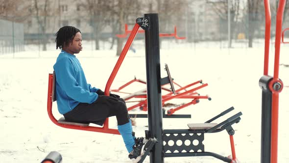 African American Man Footballer Warming Up on Sports Ground