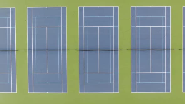 Aerial view of tennis courts side by side. Drone high angle shot