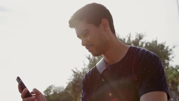 Young man using his phone