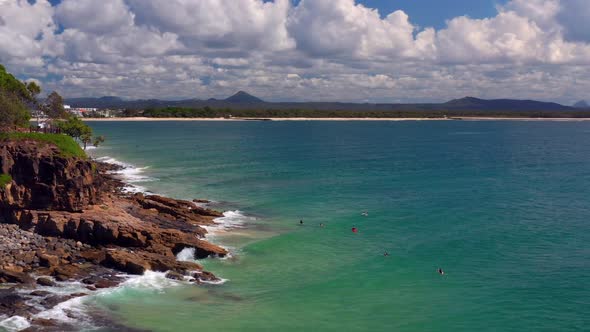 Flying Over Rocky Shoreline Of Noosa National Park With Tourist Near Noosa Heads, QLD Australia. Aer