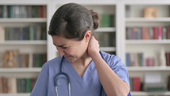 Portrait of Indian Female Doctor having Neck Pain