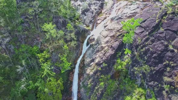 Drone Removes From Waterfall Against Landscape Sun Rays