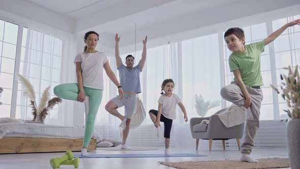 Children Training to Keep Balance in Yoga Pose