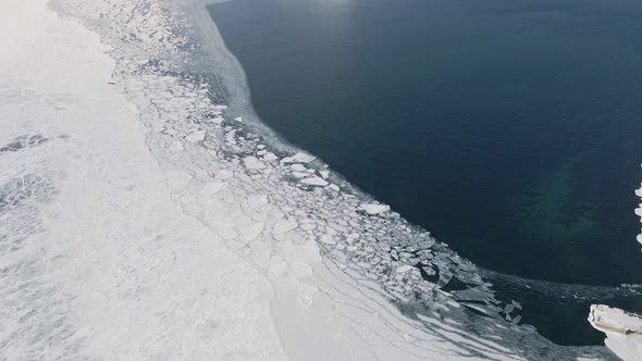 Conjunction of Frozen Ice Surface with Water in Winter