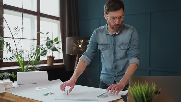 Architect Working on Blueprint with Spesial Tools and Pencil, Close Up. Male Architect at Work, Only