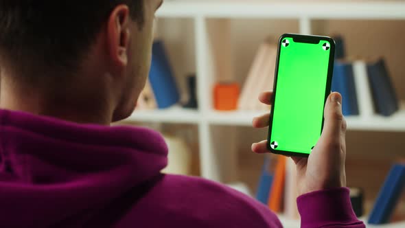 Man Using Smartphone with Chroma Key Closeup