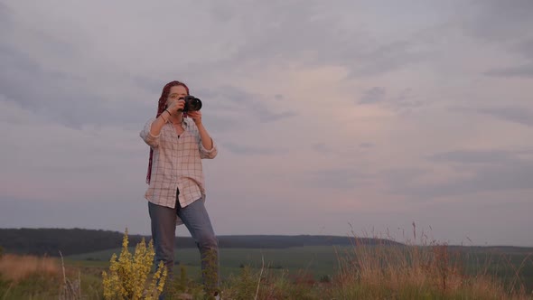 Smiling Girl Takes Photos of the Horizon