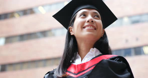 Confident woman get graduated in university