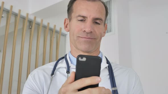 Doctor Using Smartphone for Internet