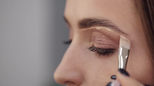 Cropped View of Girl's Face in Process of Doing Makeup