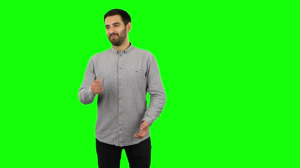 Brunette Guy Is Looking at Camera with Anticipation, Then Very Upset. Green Screen