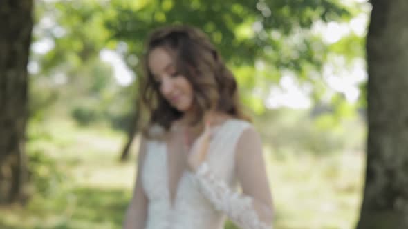 Beautiful and Lovely Bride in Wedding Dress in the Park. Slow Motion