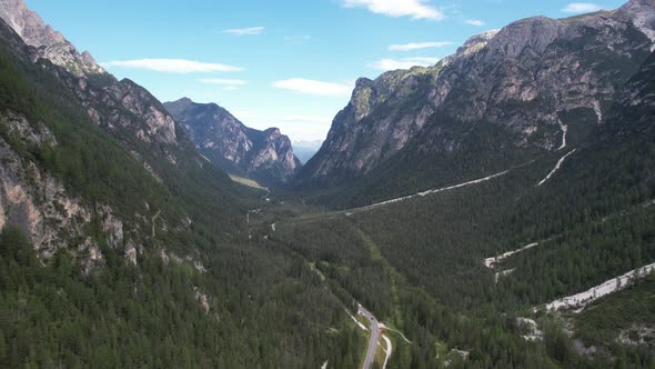 Aerial view of the green mountains forest in Dolomites, Italy