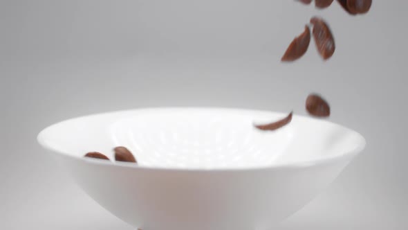 Chocolate Corn Flakes Are Falling in Slow Motion To the White Bowl, Cocoa Cereal Breakfast Falls in