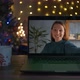 A Young Woman Waves Hello and Smiles on a Videocall - VideoHive Item for Sale