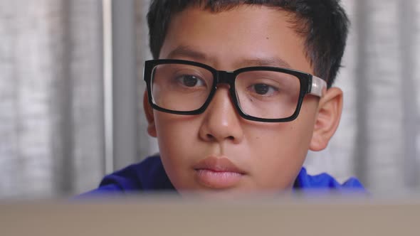 Face Asian Boy Using Computer